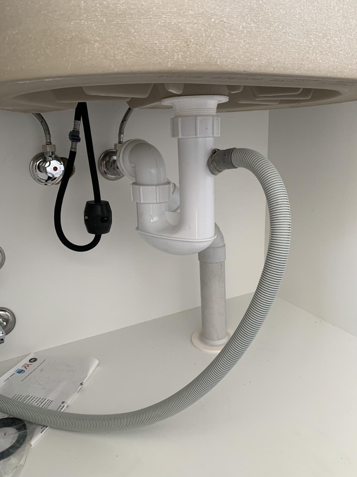 Bathroom sink trap washing machine hose provision/bypass nee