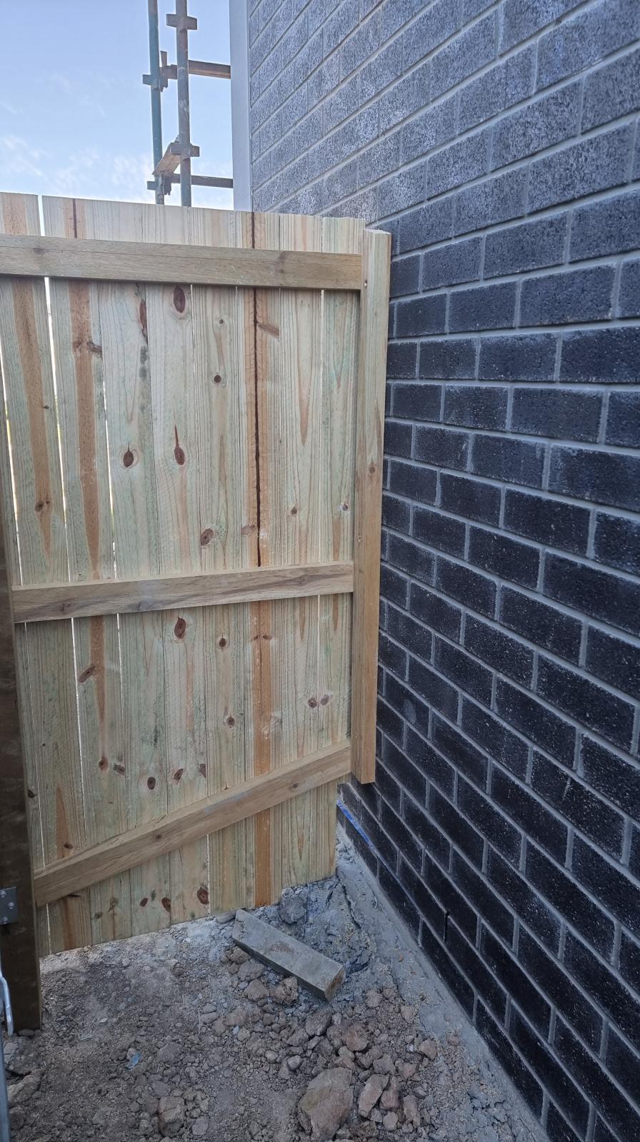 Neighbours bolted fence to my wall during construction