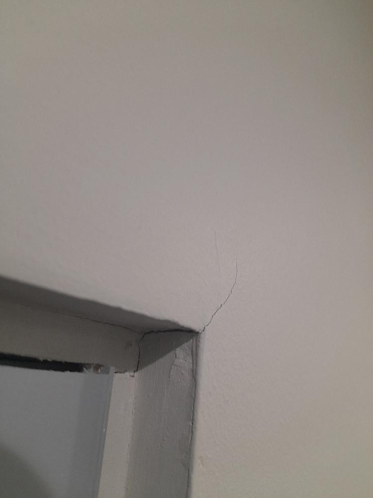 Cracks in Wall Above Door Frame