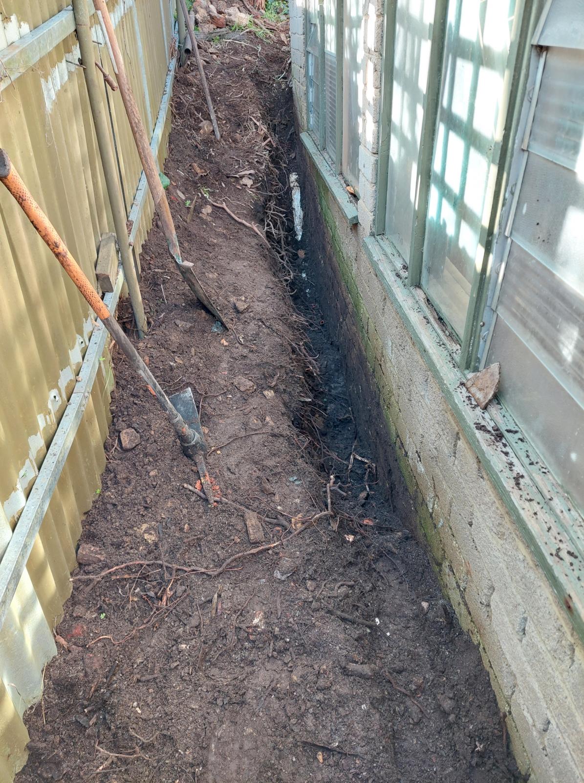 Soil against brick shed