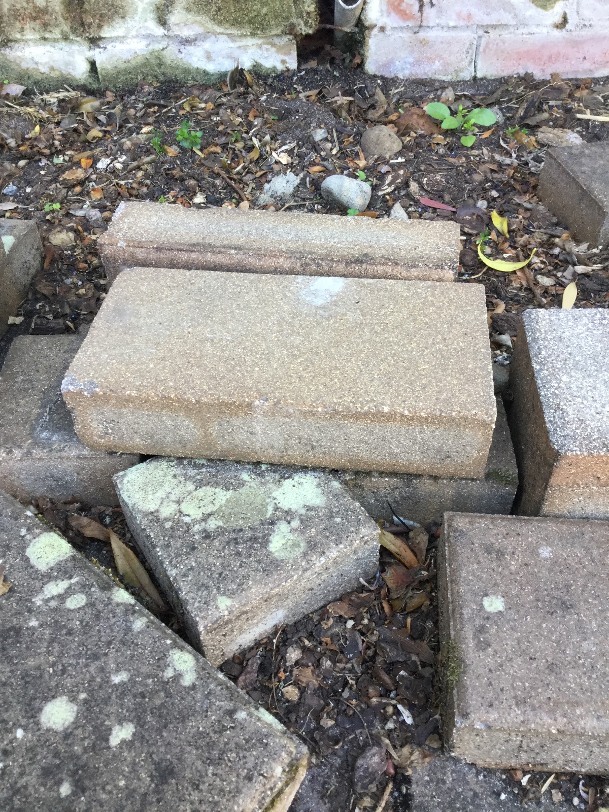 Re-cycle pavers for retaining wall