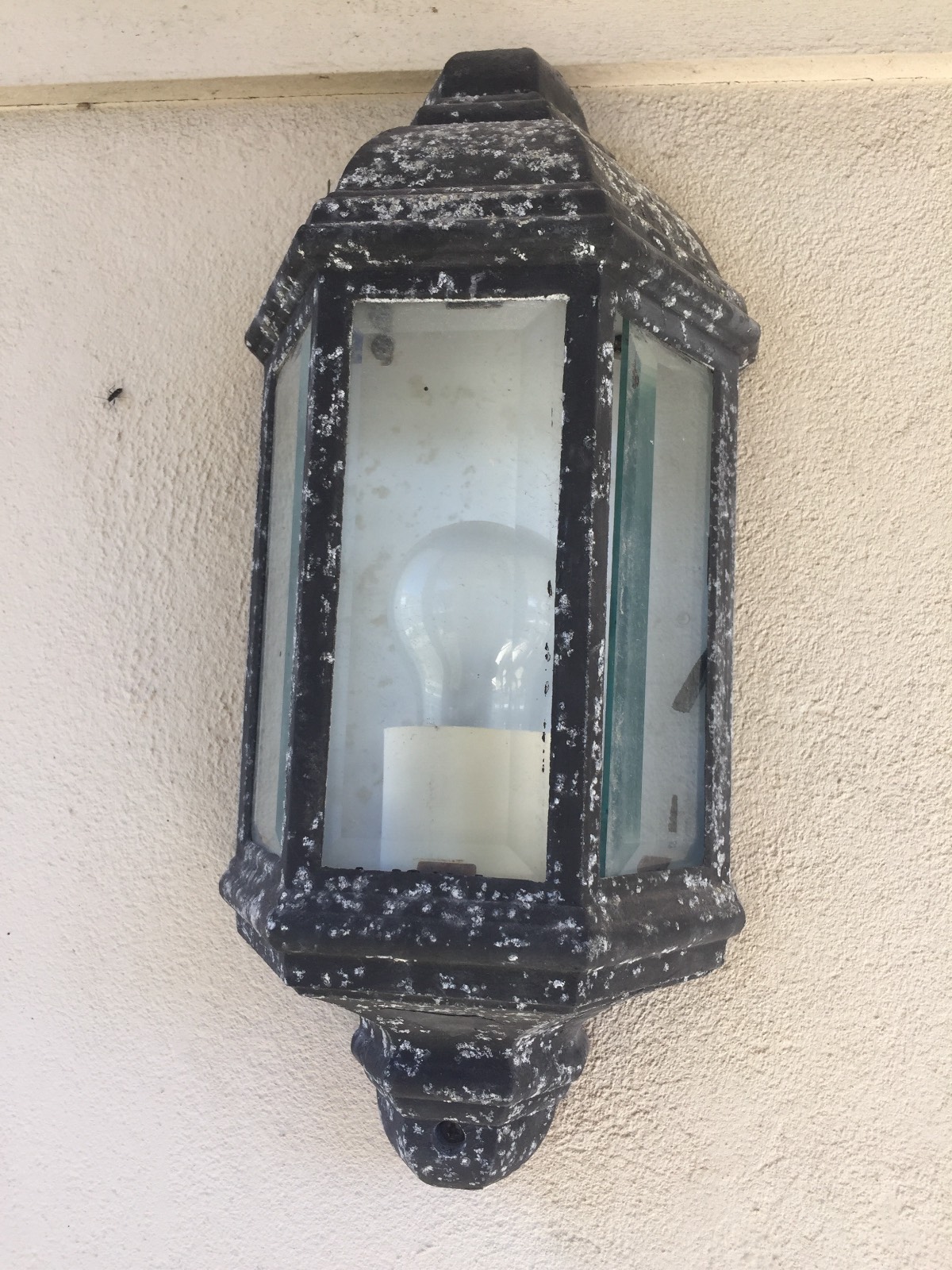 Changing a bulb outdoor light